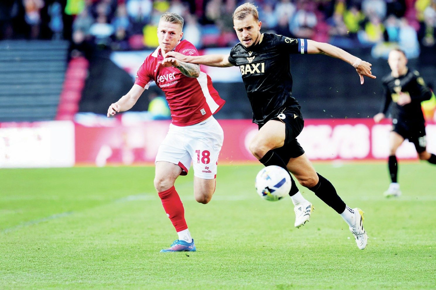 Oxford United’s Michal Helik, right, battles for the ball with Bristol City’s Emil Riis in his side’s 3-1 win
