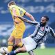 West Brom’s Kyle Bartley tackles Tottenham’s Harry Kane