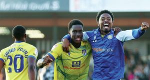 Micah Mbick, left, and Kyreece Lisbie celebrate after Colchester’s win