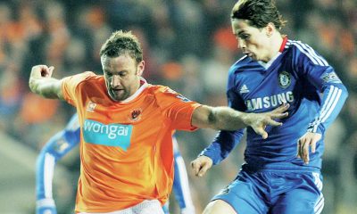Blackpool’s Ian Evatt battles with Chelsea’s Fernando Torres