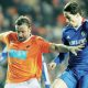 Blackpool’s Ian Evatt battles with Chelsea’s Fernando Torres