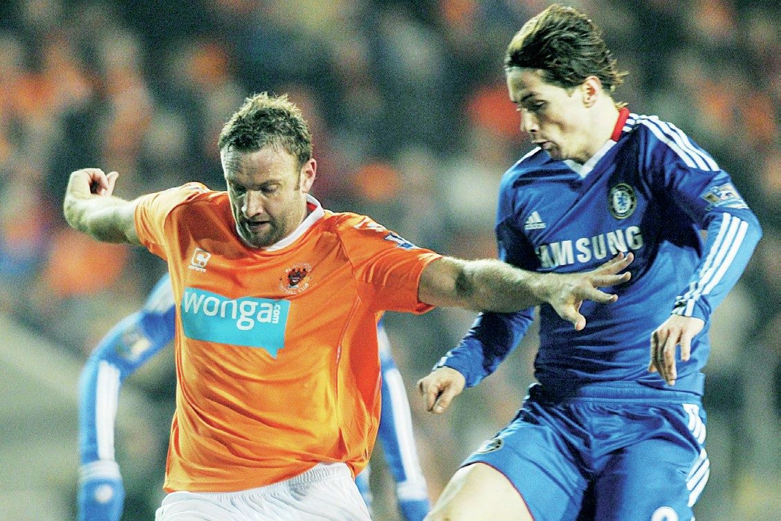 Blackpool’s Ian Evatt battles with Chelsea’s Fernando Torres
