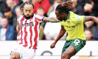 Stoke City goalscorer Sorba Thomas takes on Wrexham’s Issa Kabore before his cross flies towards the net