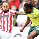 Stoke City goalscorer Sorba Thomas takes on Wrexham’s Issa Kabore before his cross flies towards the net
