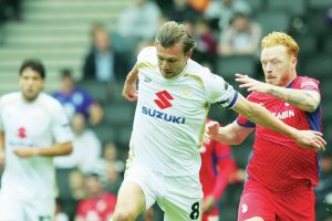 MK Dons skipper Alex Gilbey has belief his side can challenge for promotion