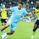 Coventry City’s Milan van Ewijk takes on Oxford United’s Greg Leigh