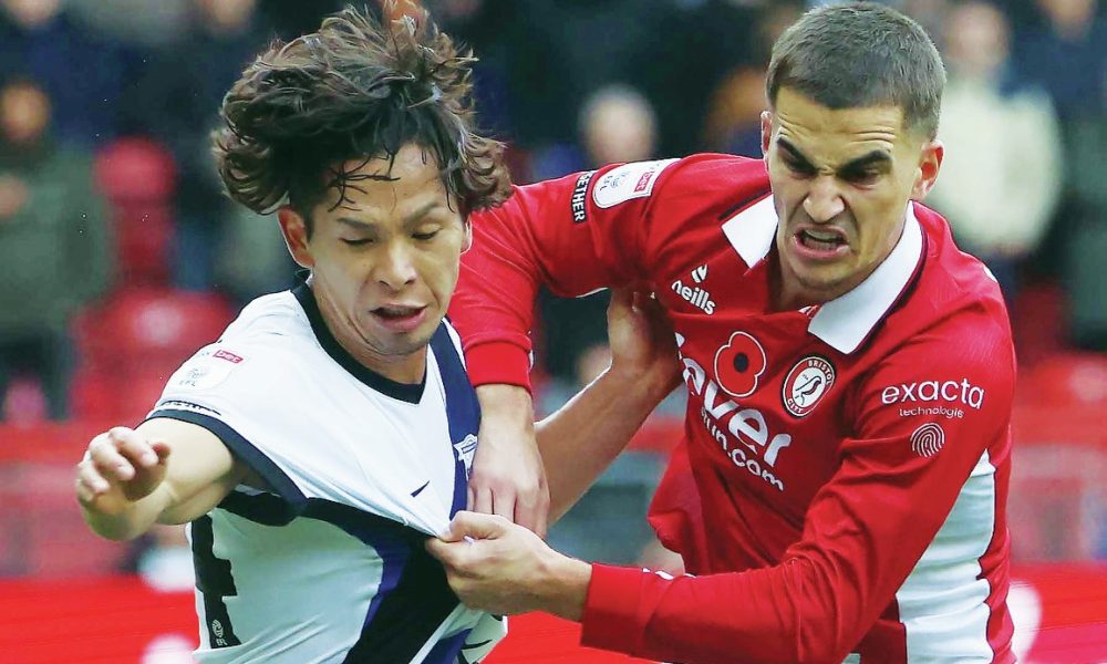 Birmingham’s Tomoki Iwata grapples with Bristol City’s Anis Mehmeti
