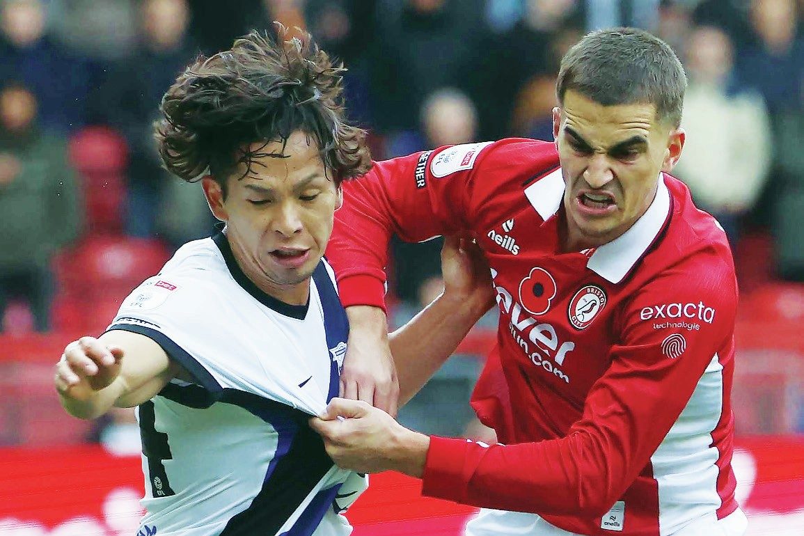 Birmingham’s Tomoki Iwata grapples with Bristol City’s Anis Mehmeti