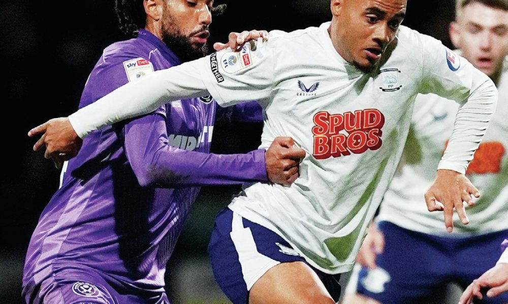 Preston North End’s Lewis Dobbin tries to escape Sheffield United’s Jairo Riedewald