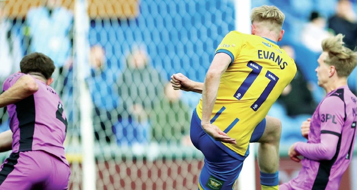 Mansfield Town’s Will Evans fires in the opening goal to make it 1-0