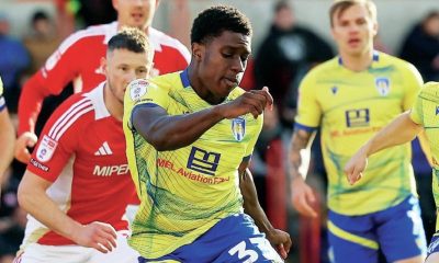 Colchester United forward Micah Mbick shoots at goal