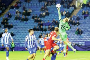 Sheffield Wednesday emergency loan goalkeeper Joe Lumley saves against Middlesbrough in the midweek action as empty seats tell the story