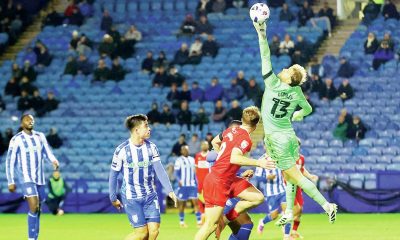 Sheffield Wednesday emergency loan goalkeeper Joe Lumley saves against Middlesbrough in the midweek action as empty seats tell the story