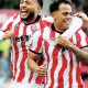 Million Manhoef, right, celebrates scoring Stoke City’s third with Lewis Baker