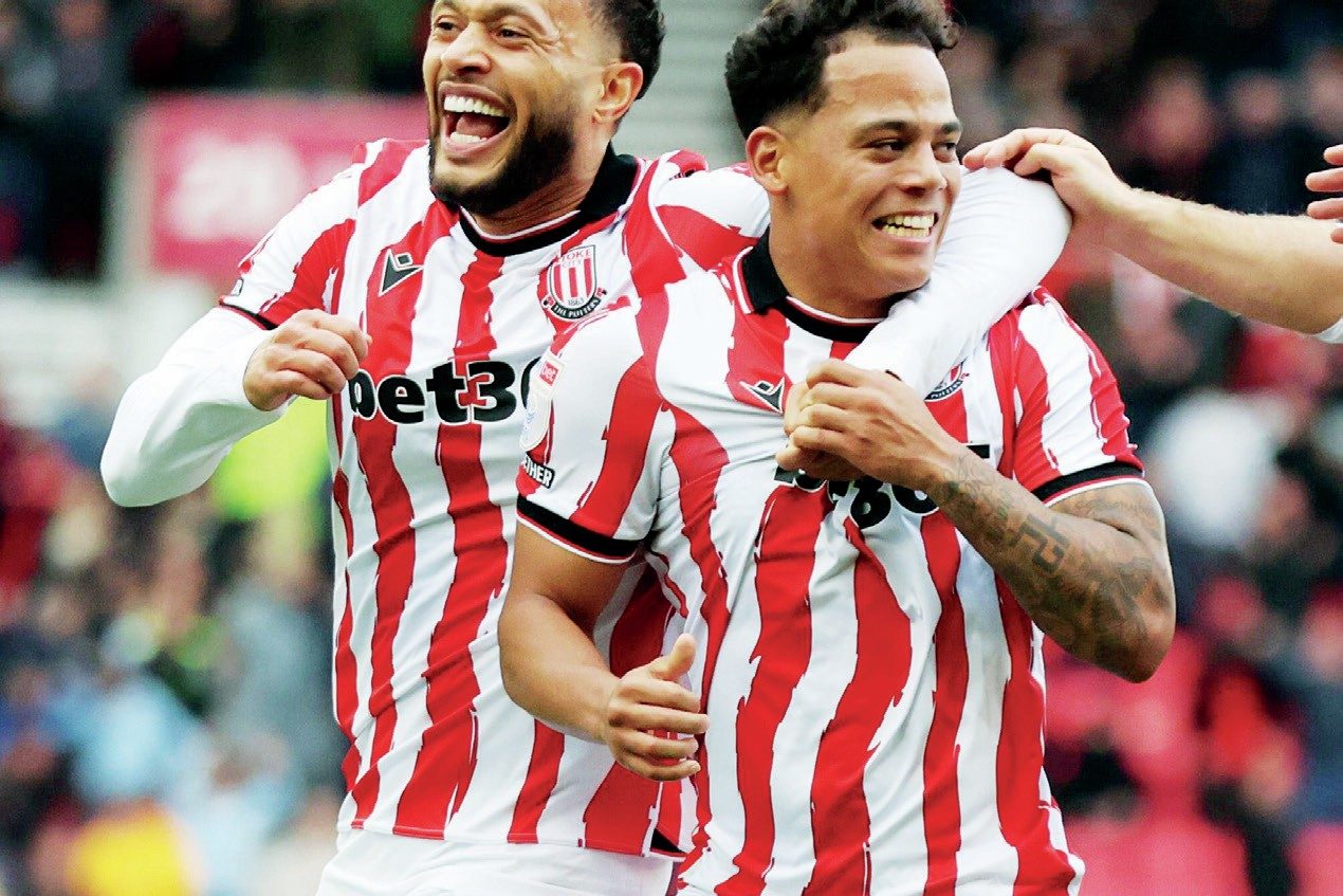 Million Manhoef, right, celebrates scoring Stoke City’s third with Lewis Baker