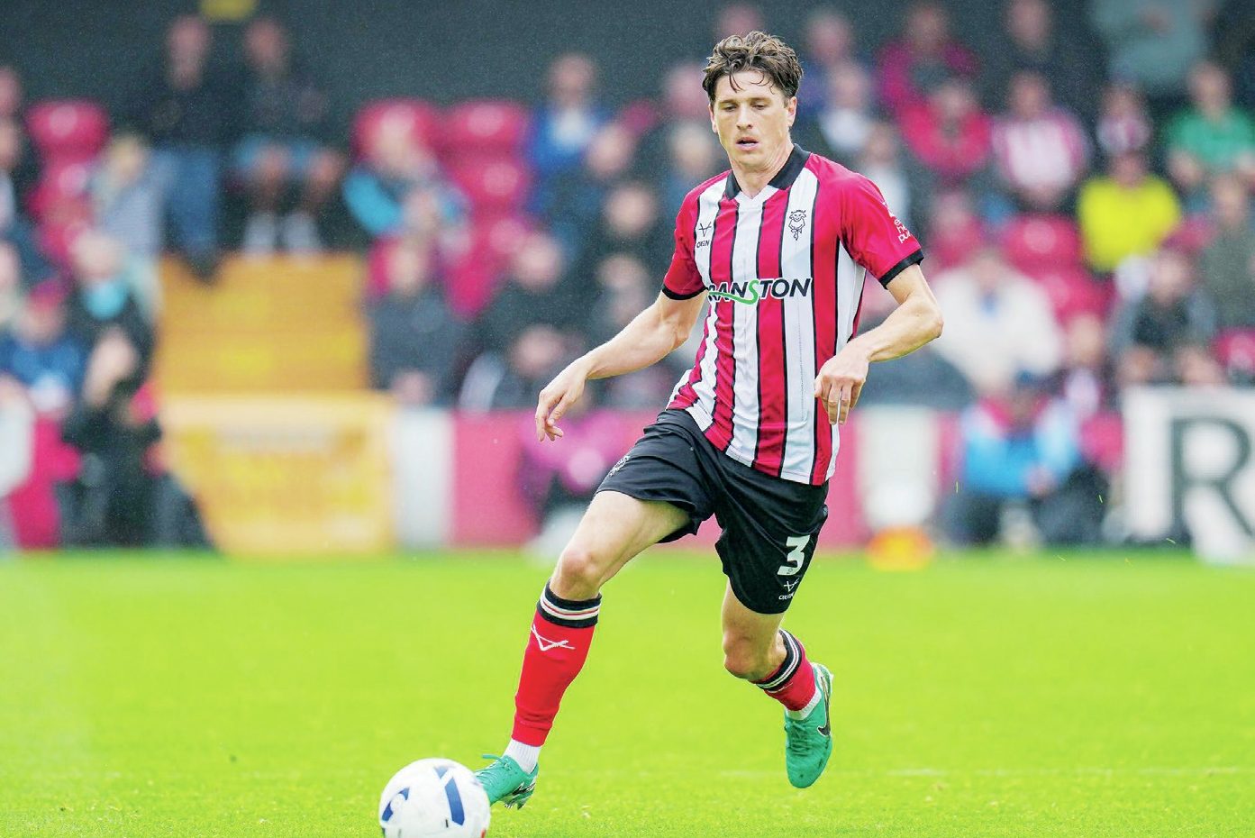 Adam Reach in action for Lincoln City