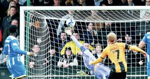 Cambridge’s James Brophy scores a fine third goal
