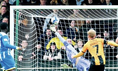 Cambridge’s James Brophy scores a fine third goal