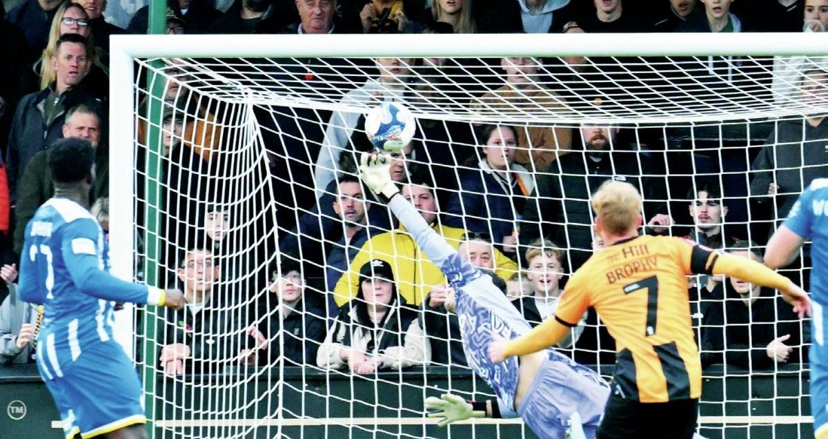 Cambridge’s James Brophy scores a fine third goal