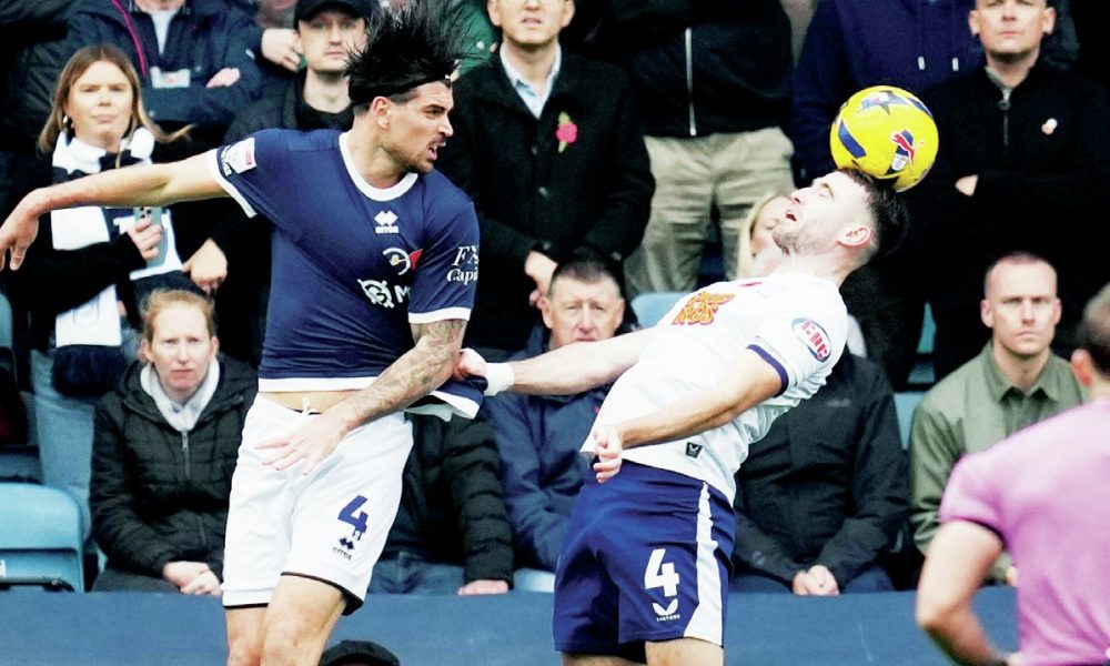 Millwall’s Tristan Crama, left, and Preston’s Ben Whiteman battle for the ball