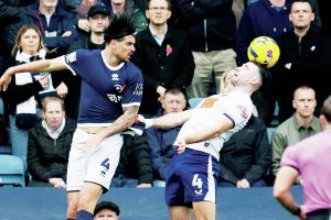 Millwall’s Tristan Crama, left, and Preston’s Ben Whiteman battle for the ball