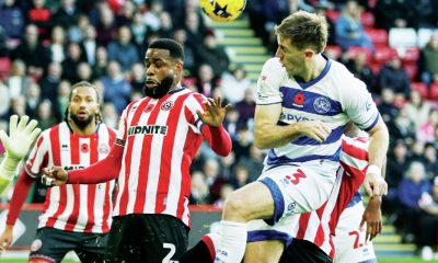 Queens Park Rangers defender Jimmy Dunne heads the ball for goal
