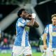 Cameron Ashia celebrates scoring Huddersfield Town’s third goal