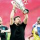 Russell Martin lifts the Championship play-off trophy in front of the Southampton fans