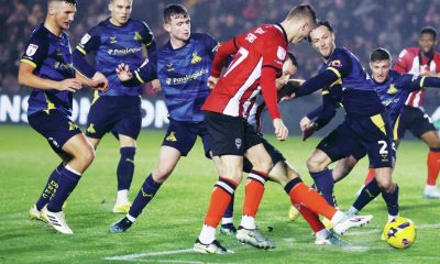 Lincoln City’s Ben House takes the shot that led to their winner