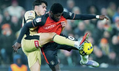Rotherham’s Reece James, left, tangles with Luton’s Gideon Kodua
