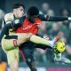 Rotherham’s Reece James, left, tangles with Luton’s Gideon Kodua