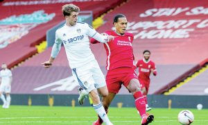 Patrick Bamford, left, scores for Leeds against Liverpool in 2020 despite the attentions of Virgil van Dijk