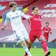 Patrick Bamford, left, scores for Leeds against Liverpool in 2020 despite the attentions of Virgil van Dijk