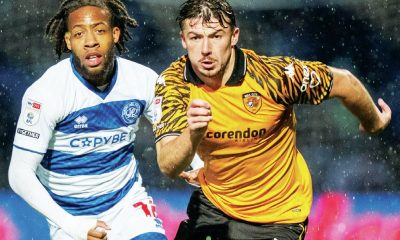 Hull City’s Charlie Hughes, right, attempts to break away from QPR match-winner Rumarn Burrell