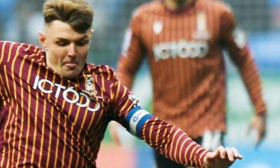 Bradford’s Max Power obattles for the ball with Bolton’s Jordi Osei-Tutu