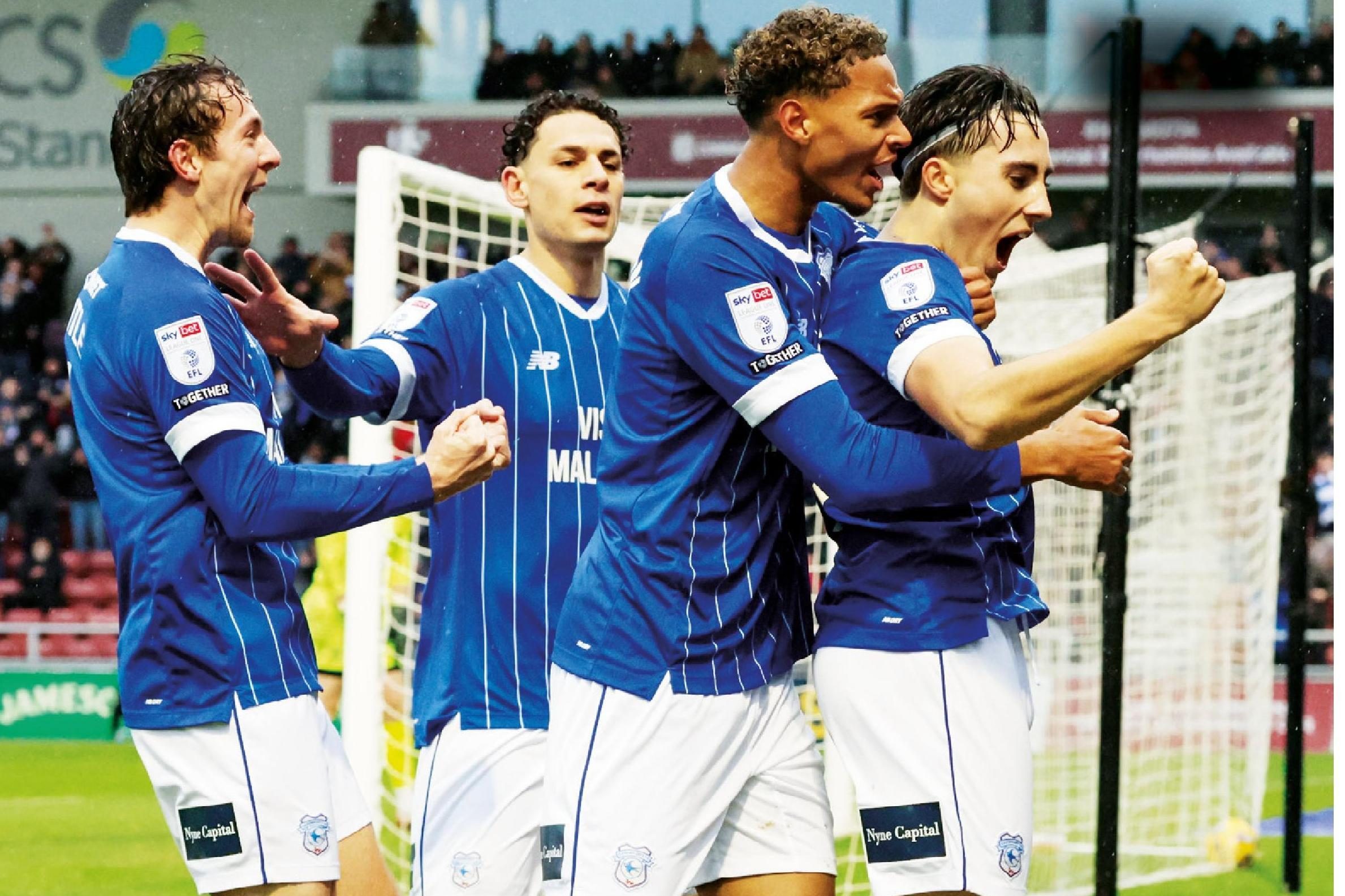 Joel Colwill celebrates with team mates after scoring for Cardiff City