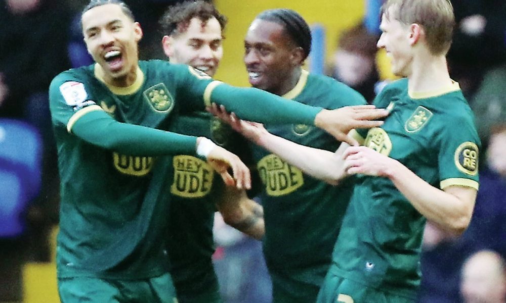 Lasse Sorensen, right, celebrates scoring the Terriers’ third with his teammates