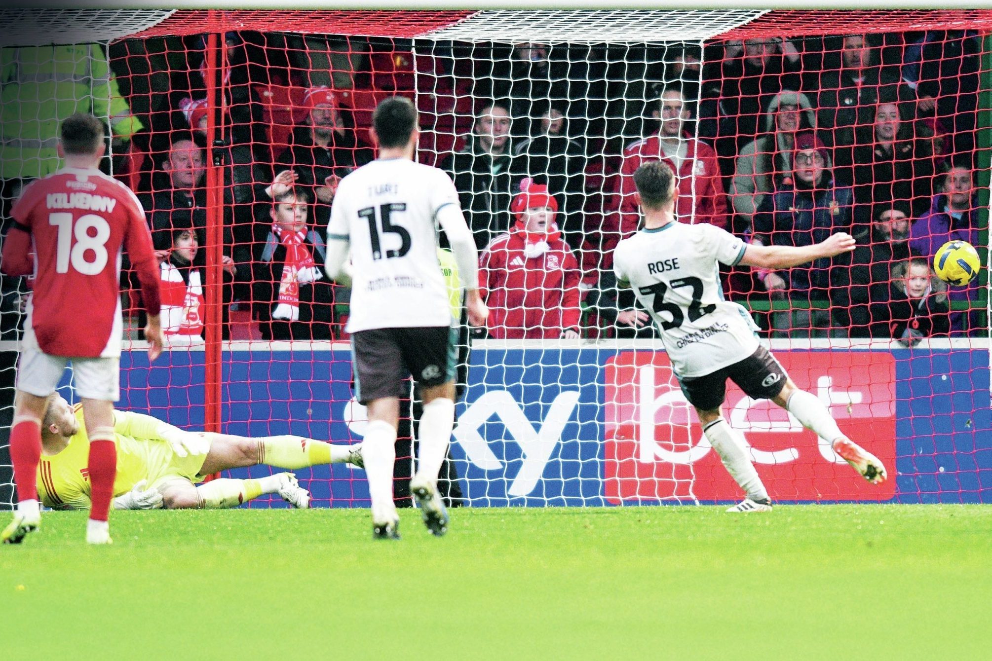Grimsby Town’s Danny Rose sends Swindon Town goalkeeper Connor Ripley the wrong way from the penalty spot to level it up