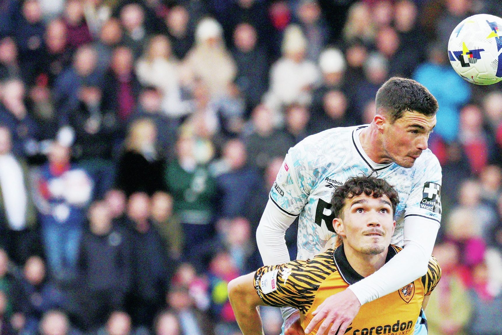 Lloyd Jones wins a header against Hull’s Kyle Joseph