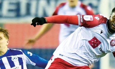 Wigan’s Matt Smith, left, makes a challenge on Boro’s Beryly Lubala