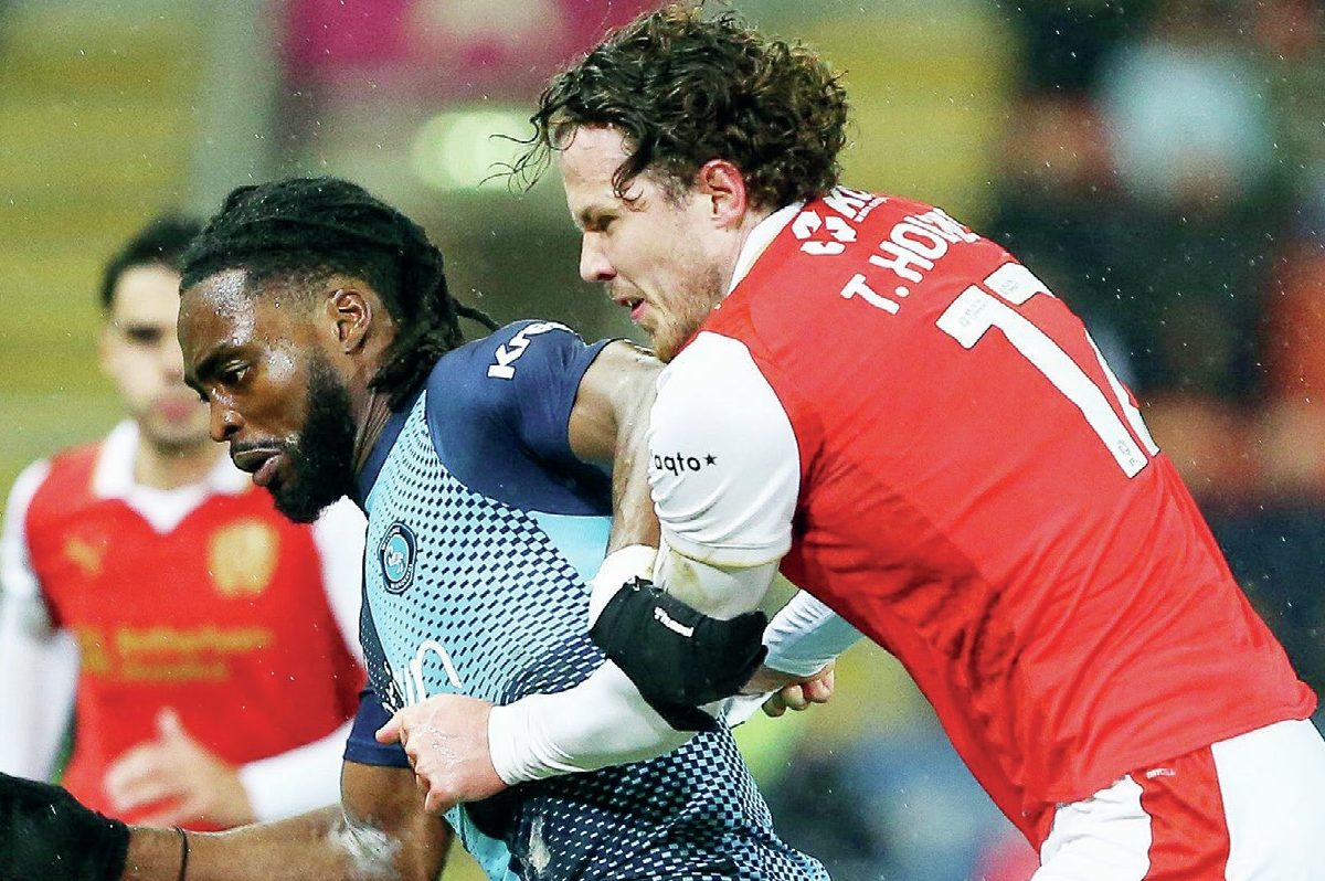 Fred Onyedinma shields the ball from Rotherham’s Tom Holmes