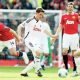 Swansea’s Joe Allen, centre, and Leon Britton, right, in possession against Manchester United