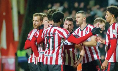 Cheltenham Town celebrate their fourth goal