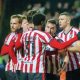 Cheltenham Town celebrate their fourth goal