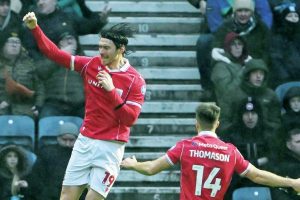 Kieffer Moore enjoys his early goal for the Red Dragons