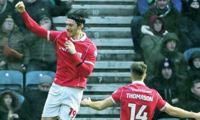 Kieffer Moore enjoys his early goal for the Red Dragons