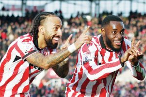 Stoke City goalscorer Sorba Thomas, left, celebrates with Junior Tchamadeu