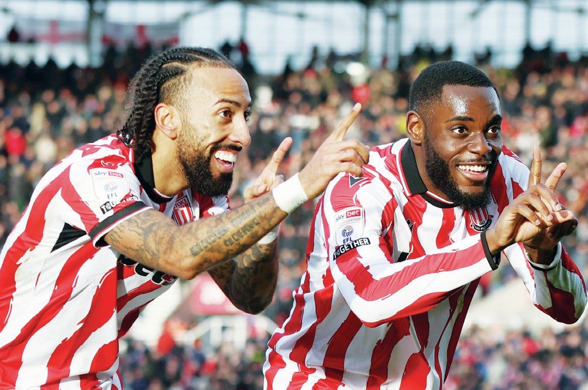 Stoke City goalscorer Sorba Thomas, left, celebrates with Junior Tchamadeu