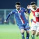 The Faroe Islands’ Geza Turi, left, competes with Croatia’s Ivan Perisic