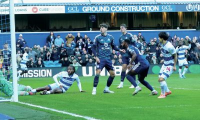 Koki Saito, right, watches on as the ball bounces off him and into the net to put QPR ahead early on